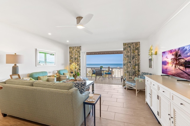 tiled living room with ceiling fan and a healthy amount of sunlight