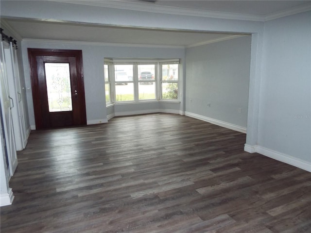 interior space with crown molding, a barn door, and dark hardwood / wood-style flooring