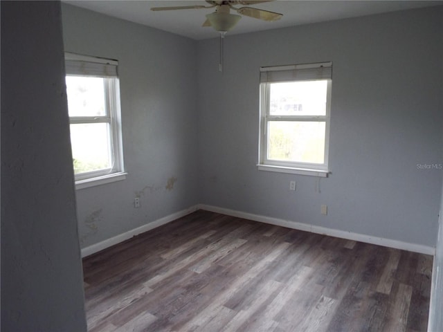 unfurnished room featuring hardwood / wood-style flooring, ceiling fan, and a wealth of natural light