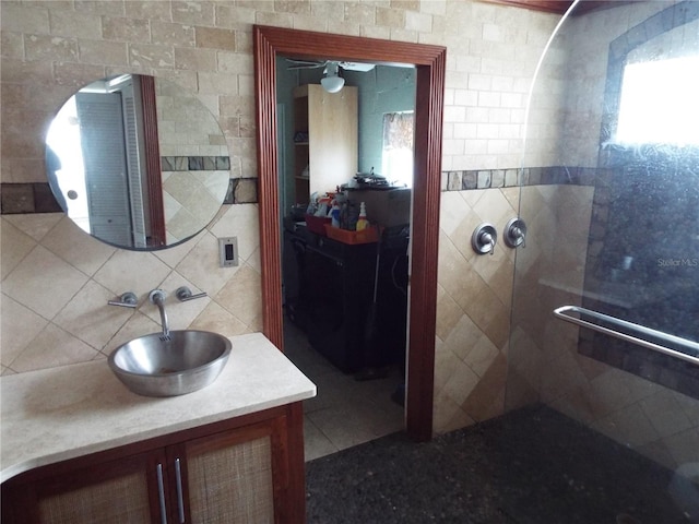 bathroom featuring tasteful backsplash, vanity, and tile walls