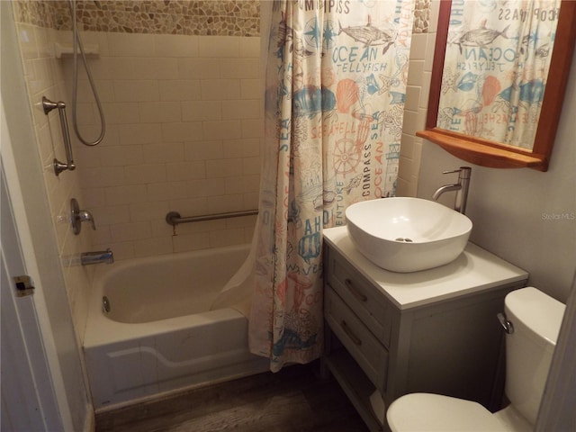 full bathroom with vanity, wood-type flooring, shower / tub combo, and toilet