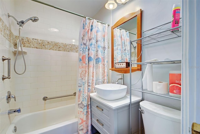 full bathroom featuring vanity, shower / bathtub combination with curtain, and toilet