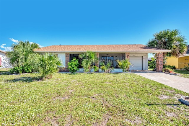 ranch-style house with a carport, a garage, and a front yard