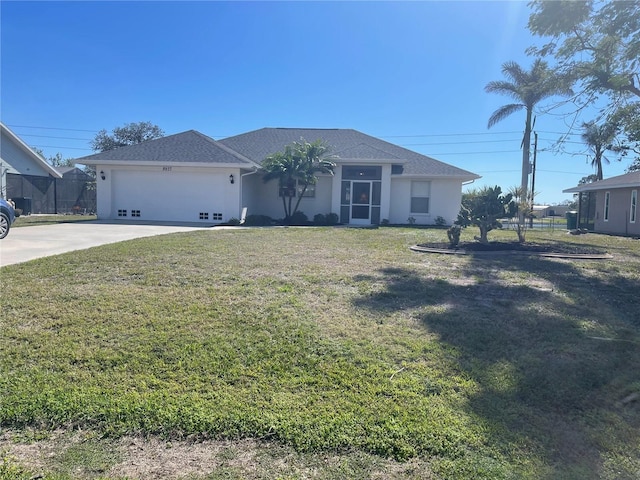 view of front of property with a garage and a front yard