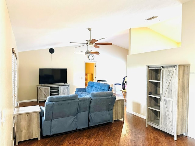 living room with ceiling fan, dark hardwood / wood-style flooring, and vaulted ceiling