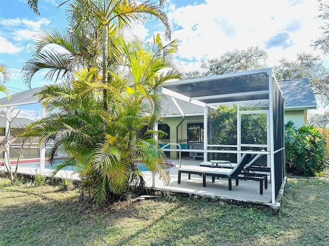 view of yard with a patio and a lanai