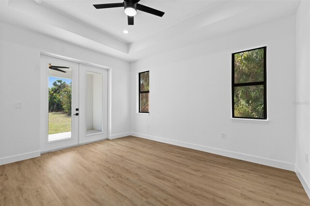 empty room with light wood-style floors, ceiling fan, baseboards, and recessed lighting