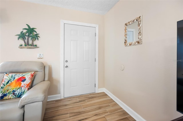 entryway featuring a textured ceiling