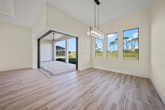 unfurnished dining area featuring light wood-type flooring