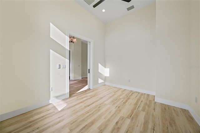 spare room featuring ceiling fan and light hardwood / wood-style floors