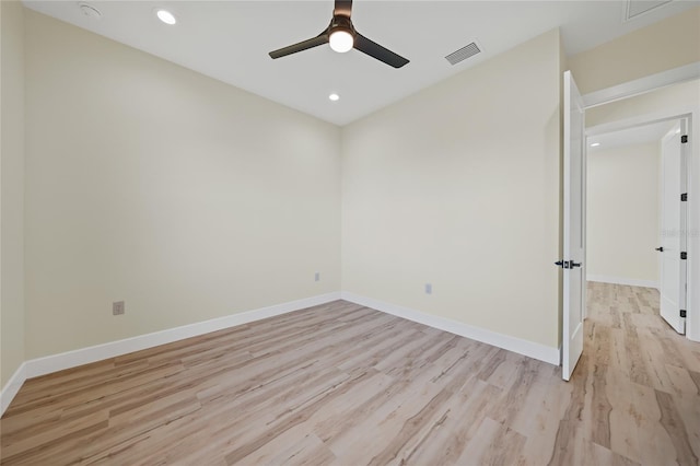 spare room featuring ceiling fan and light wood-type flooring