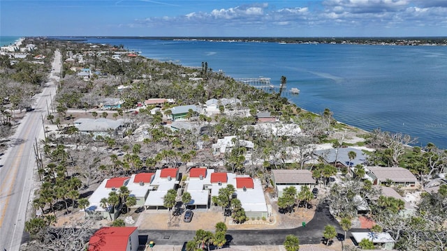 drone / aerial view with a water view and a residential view