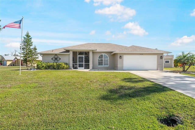 view of front of house with a garage and a front lawn