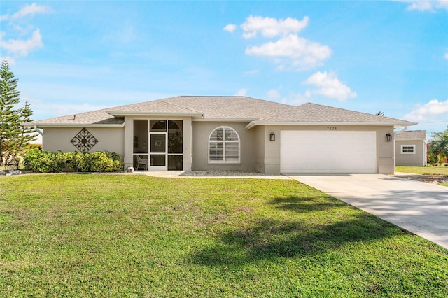 view of front facade with a garage and a front lawn