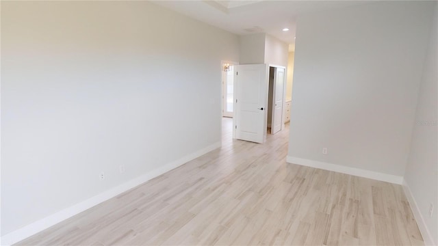 unfurnished room featuring light hardwood / wood-style flooring