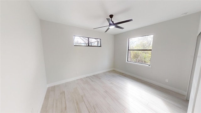 spare room featuring ceiling fan and light hardwood / wood-style flooring