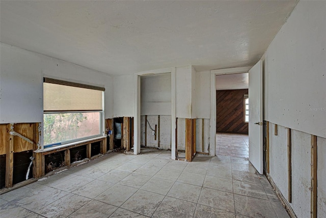 interior space featuring wooden walls