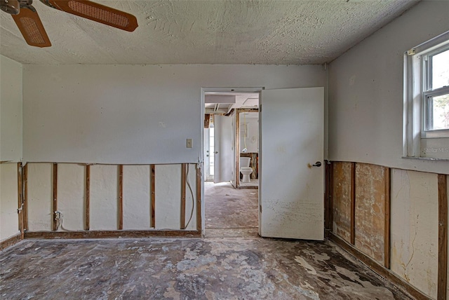 spare room featuring a textured ceiling