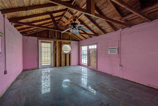 interior space featuring an AC wall unit and vaulted ceiling