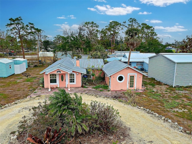 view of outdoor structure featuring driveway