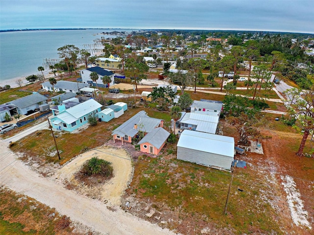 bird's eye view featuring a water view and a residential view