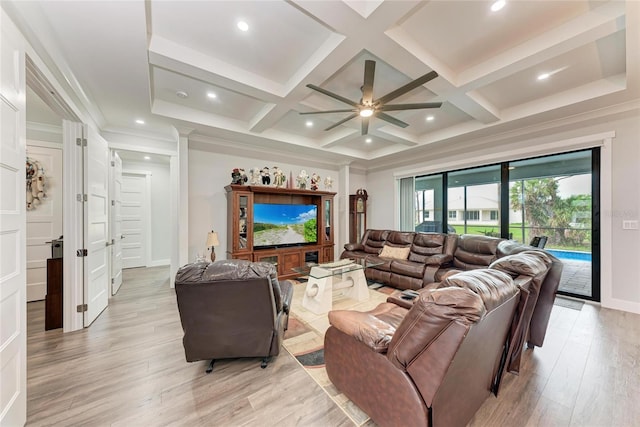 living room featuring coffered ceiling, ceiling fan, light wood-type flooring, and beam ceiling