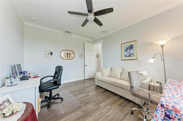 office space with ceiling fan, ornamental molding, and wood-type flooring