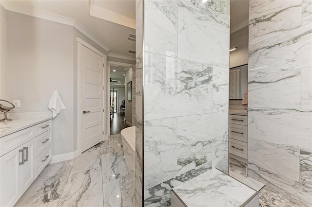 bathroom featuring ornamental molding and vanity