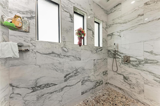 bathroom featuring tiled shower