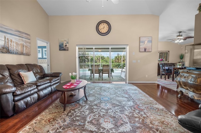 living room featuring dark hardwood / wood-style floors and ceiling fan