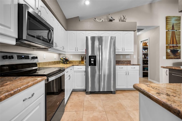 kitchen featuring stainless steel appliances, white cabinetry, stone countertops, and light tile patterned floors