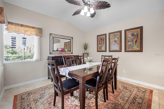 tiled dining room featuring ceiling fan and lofted ceiling