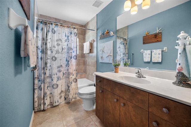 full bathroom featuring vanity, toilet, tile patterned flooring, and shower / bath combo