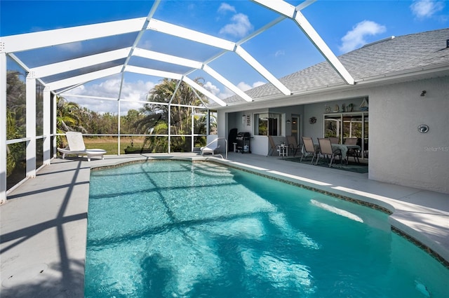 view of pool featuring a lanai and a patio area