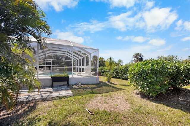 view of yard with a patio and a lanai