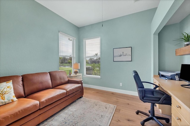 office space with light hardwood / wood-style flooring