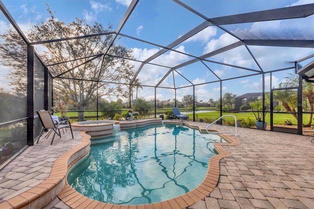 view of pool with an in ground hot tub, a lanai, pool water feature, and a patio