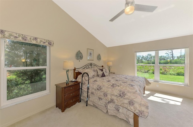 bedroom featuring a ceiling fan, lofted ceiling, and light colored carpet