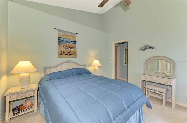 bedroom with a ceiling fan, carpet, and baseboards