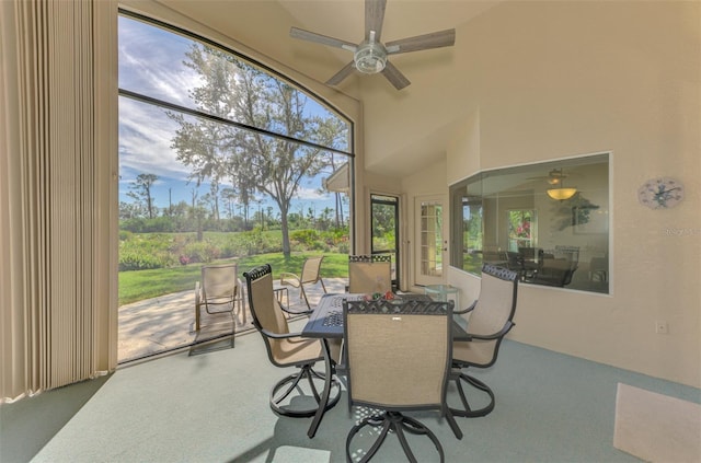 sunroom / solarium with a ceiling fan