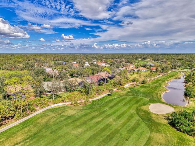 birds eye view of property featuring golf course view and a water view