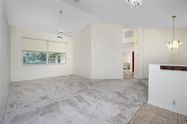 unfurnished living room featuring light carpet, high vaulted ceiling, and ceiling fan with notable chandelier