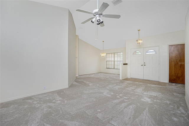 interior space with high vaulted ceiling and ceiling fan with notable chandelier