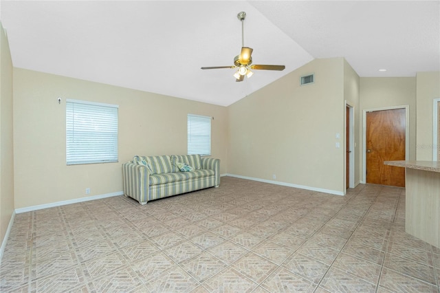 unfurnished living room with ceiling fan and lofted ceiling