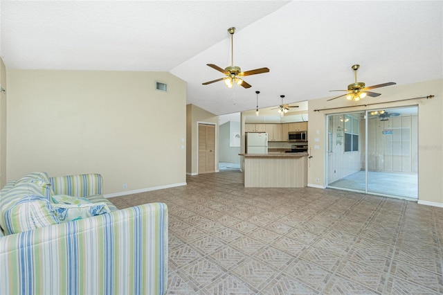 unfurnished living room featuring a textured ceiling and lofted ceiling