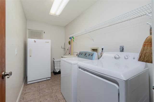 washroom featuring separate washer and dryer