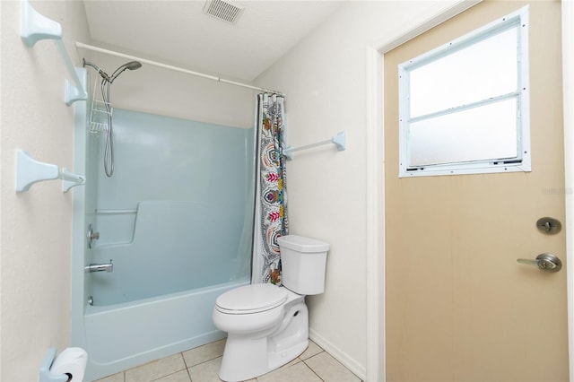 bathroom featuring tile patterned flooring, toilet, and shower / bath combination with curtain