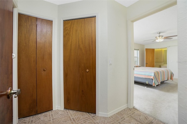 unfurnished bedroom featuring multiple closets