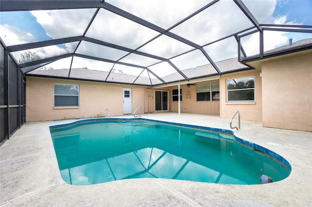 view of swimming pool with a patio and a lanai