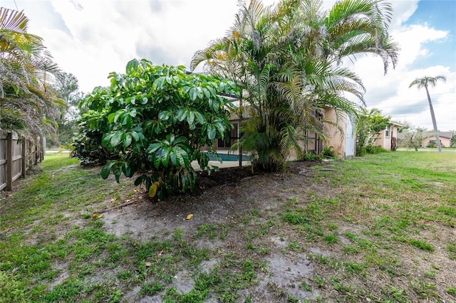 view of yard featuring a lanai